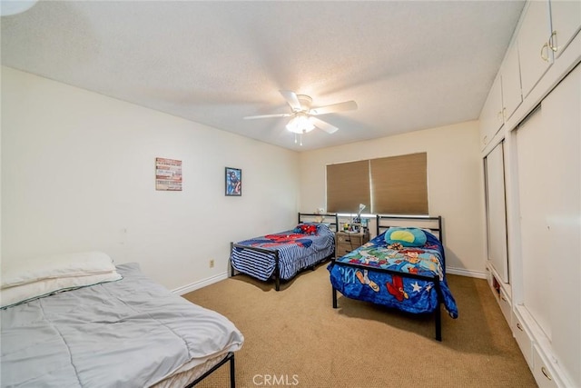 12995 Leith Way, Yucaipa, CA 92399 - carpeted bedroom featuring a closet, a ceiling fan, and a textured ceiling