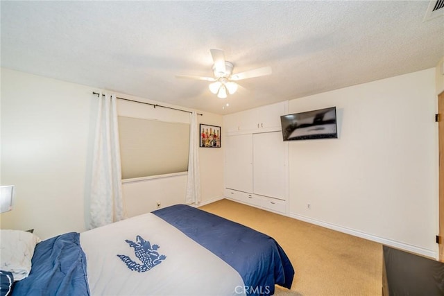 12995 Leith Way, Yucaipa, CA 92399 - bedroom featuring light carpet, a ceiling fan, and a textured ceiling