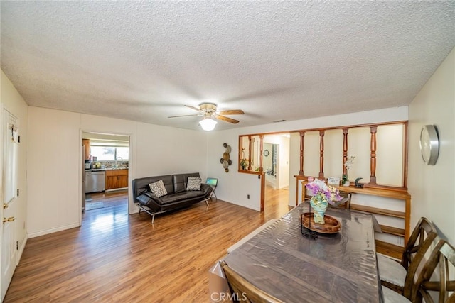 12995 Leith Way, Yucaipa, CA 92399 - living area with light wood finished floors, a textured ceiling, and a ceiling fan