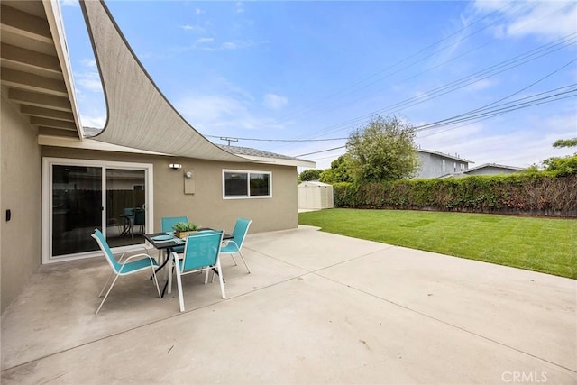 19331 Cindy Ln, Huntington Beach, CA 92646 - view of patio with a shed and outdoor dining area