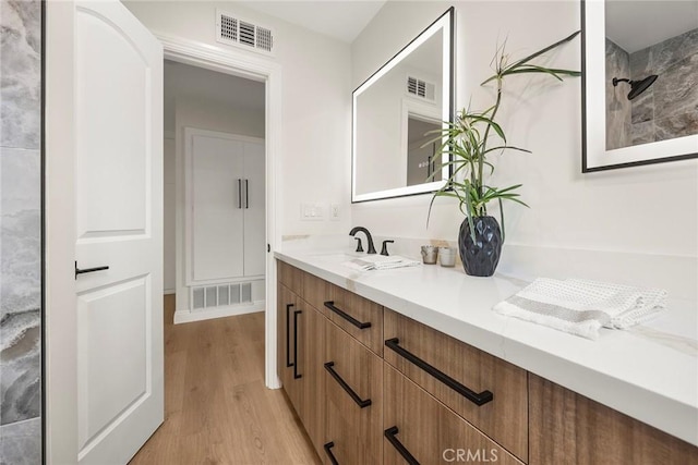 19331 Cindy Ln, Huntington Beach, CA 92646 - full bathroom featuring wood finished floors and vanity