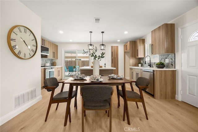 19331 Cindy Ln, Huntington Beach, CA 92646 - dining room with light wood-style flooring