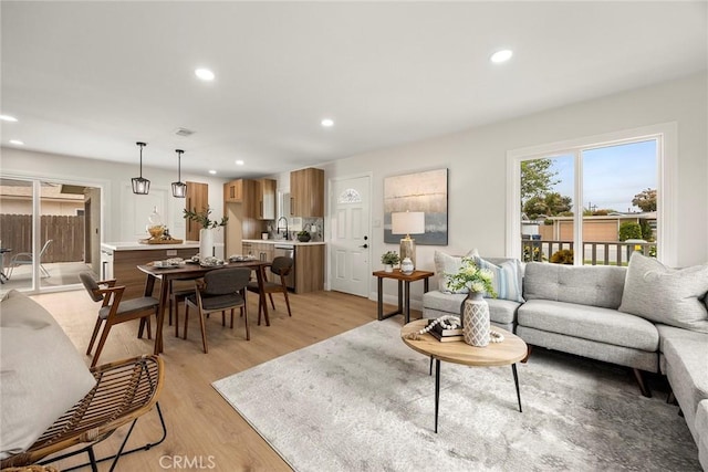19331 Cindy Ln, Huntington Beach, CA 92646 - living area with light wood-style flooring and recessed lighting