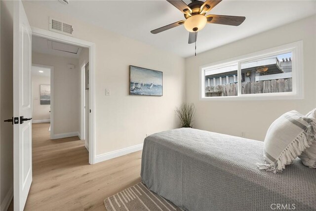 19331 Cindy Ln, Huntington Beach, CA 92646 - bedroom with light wood finished floors and ceiling fan