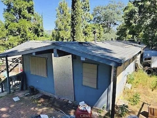 12441 Pine St, Clearlake Oaks, CA 95423 - view of side of home with stucco siding