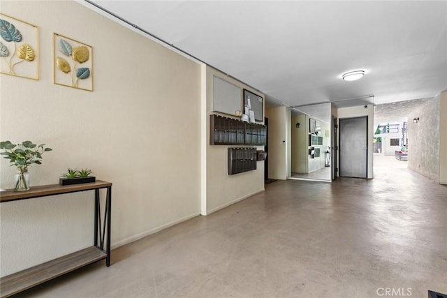 635 E Elmwood Ave Unit 307, Burbank, CA 91501 - hallway featuring concrete flooring and baseboards