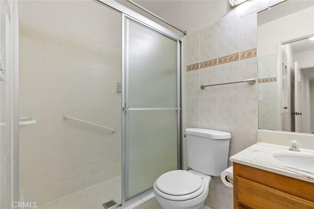 635 E Elmwood Ave Unit 307, Burbank, CA 91501 - bathroom featuring vanity, a stall shower, and tile walls