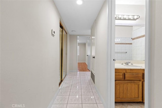635 E Elmwood Ave Unit 307, Burbank, CA 91501 - hall with a sink and light tile patterned floors