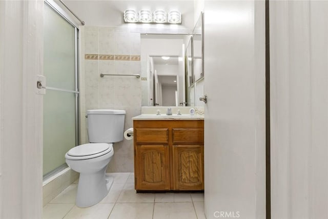 635 E Elmwood Ave Unit 307, Burbank, CA 91501 - full bathroom featuring tile patterned floors, vanity, a shower stall, and tile walls