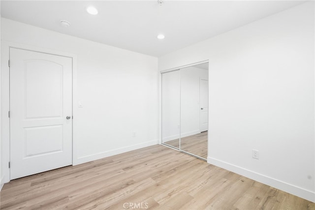 10415 Avalon Blvd, Los Angeles, CA 90003 - unfurnished bedroom with light wood-style floors, a closet, and recessed lighting