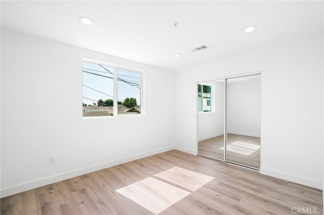 10415 Avalon Blvd, Los Angeles, CA 90003 - unfurnished bedroom with recessed lighting, light wood-style floors, and a closet