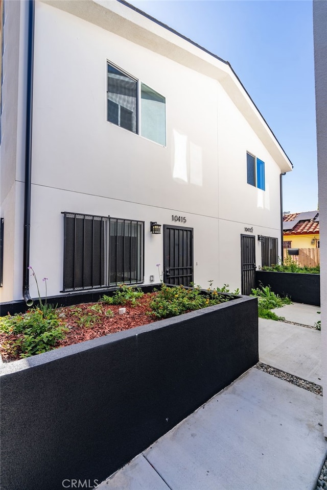 10415 Avalon Blvd, Los Angeles, CA 90003 - view of home's exterior featuring stucco siding