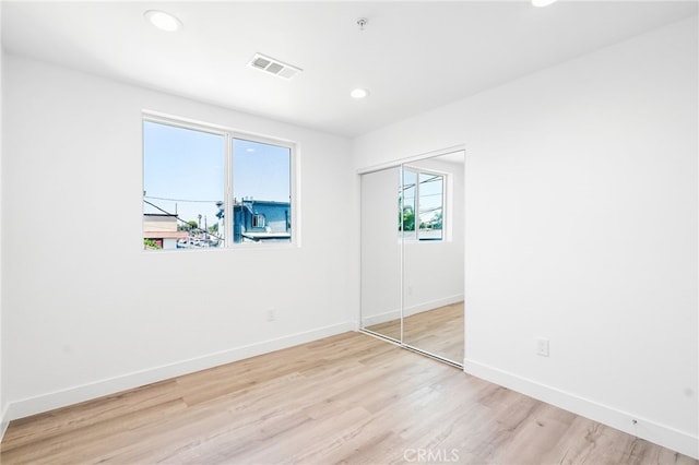 10415 Avalon Blvd, Los Angeles, CA 90003 - unfurnished bedroom featuring light wood-style floors, recessed lighting, and a closet