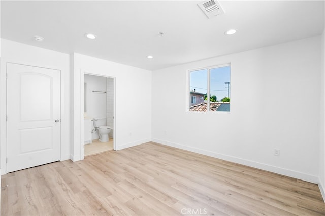 10415 Avalon Blvd, Los Angeles, CA 90003 - unfurnished bedroom featuring light wood-style floors, recessed lighting, and ensuite bath