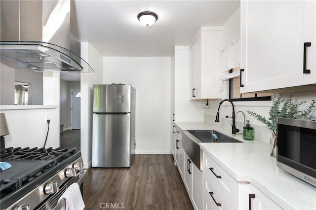 4134 Rio Hondo Ave, Rosemead, CA 91770 - kitchen featuring appliances with stainless steel finishes, island range hood, white cabinets, dark wood-type flooring, and light stone countertops