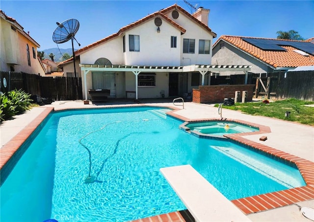 186 S Massachusetts St, Lake Elsinore, CA 92530 - view of pool featuring a pergola, a diving board, a patio area, a fenced backyard, and a pool with connected hot tub