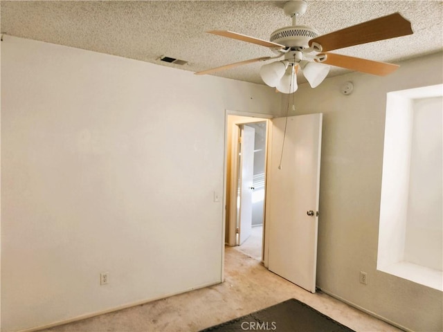 186 S Massachusetts St, Lake Elsinore, CA 92530 - unfurnished bedroom with light carpet, a ceiling fan, and a textured ceiling
