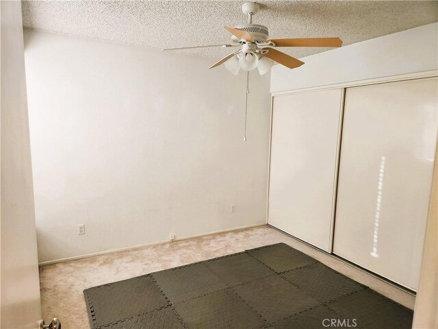 186 S Massachusetts St, Lake Elsinore, CA 92530 - empty room with light colored carpet, ceiling fan, and a textured ceiling