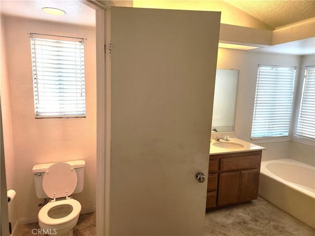 186 S Massachusetts St, Lake Elsinore, CA 92530 - bathroom featuring vanity, a garden tub, vaulted ceiling, and plenty of natural light