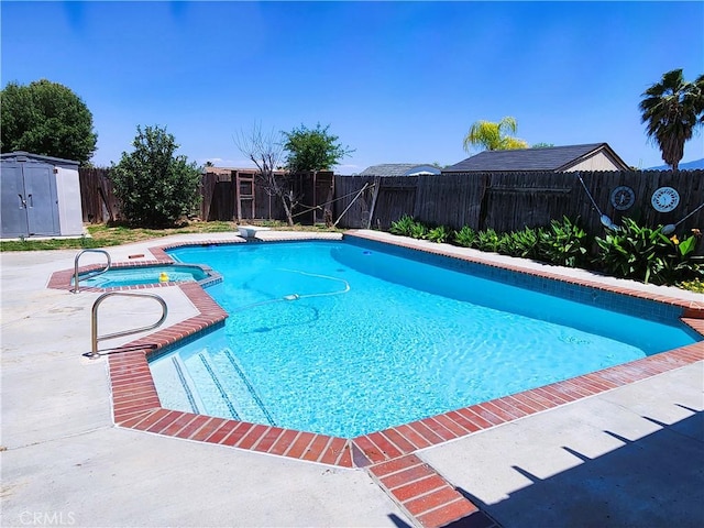 186 S Massachusetts St, Lake Elsinore, CA 92530 - view of swimming pool with a fenced backyard, a shed, and a pool with connected hot tub