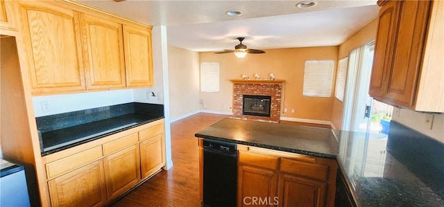 186 S Massachusetts St, Lake Elsinore, CA 92530 - kitchen featuring ceiling fan, dark wood-style floors, dark countertops, open floor plan, and a peninsula