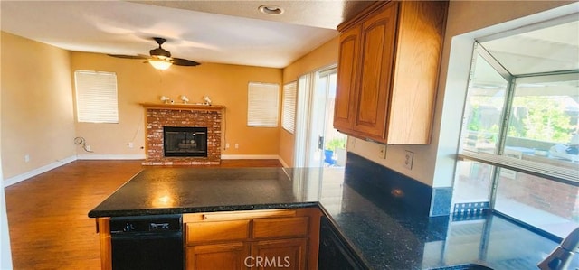 186 S Massachusetts St, Lake Elsinore, CA 92530 - kitchen featuring a peninsula, a ceiling fan, wood finished floors, and brown cabinets