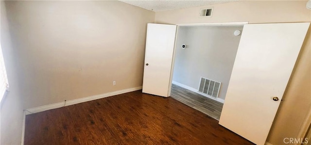 186 S Massachusetts St, Lake Elsinore, CA 92530 - empty room with wood finished floors and a textured ceiling