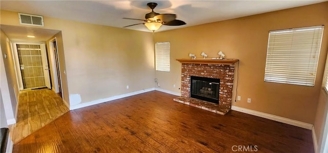 186 S Massachusetts St, Lake Elsinore, CA 92530 - unfurnished living room with wood finished floors, a fireplace, and ceiling fan
