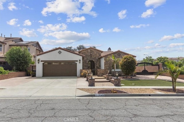 7145 Sunnyside Pl, Rancho Cucamonga, CA 91739 - view of front of house featuring a garage, concrete driveway, stucco siding, and a tiled roof