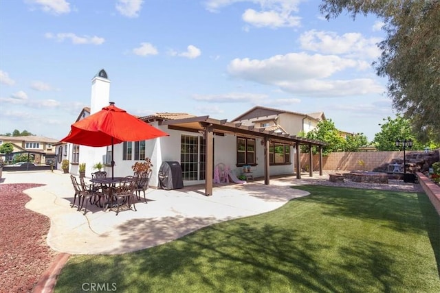 7145 Sunnyside Pl, Rancho Cucamonga, CA 91739 - back of property with a fenced backyard, a patio area, stucco siding, a chimney, and a pergola