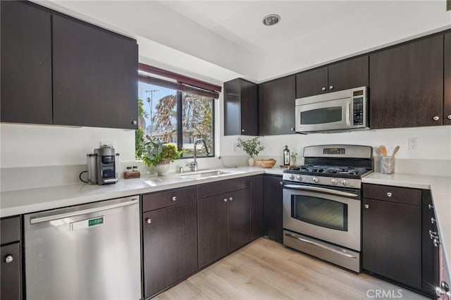7124 Hollywood Blvd Unit 5, Los Angeles, CA 90046 - kitchen with stainless steel appliances, light wood-type flooring, and light countertops