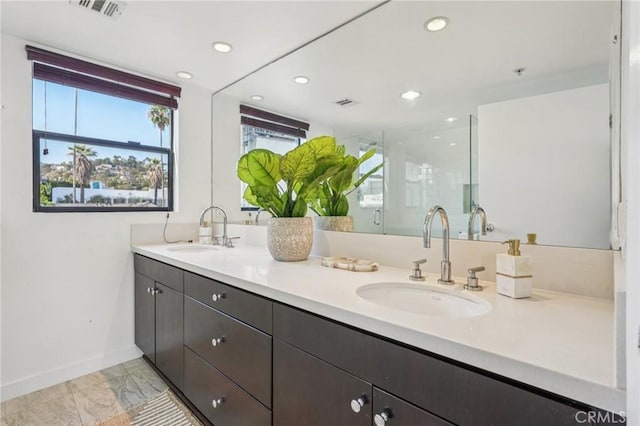 7124 Hollywood Blvd Unit 5, Los Angeles, CA 90046 - full bath with marble look tiles, double vanity, a shower stall, and recessed lighting