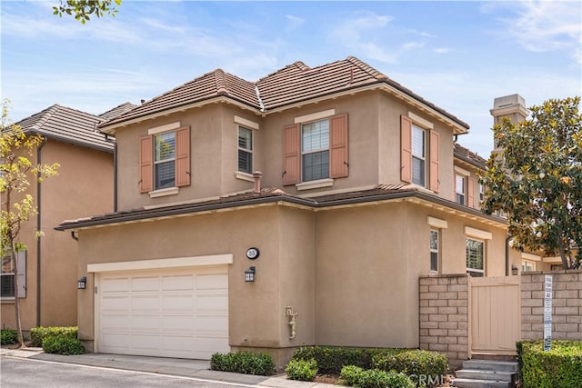 35 Twin Gables, Irvine, CA 92620 - view of property featuring an attached garage, a tile roof, and stucco siding