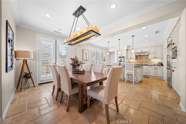 35 Twin Gables, Irvine, CA 92620 - dining space featuring stone tile floors, recessed lighting, and crown molding
