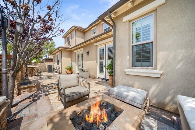 35 Twin Gables, Irvine, CA 92620 - view of patio / terrace with an outdoor living space with a fire pit
