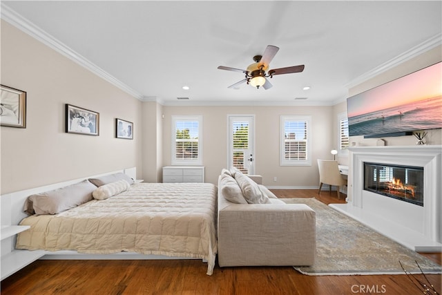 35 Twin Gables, Irvine, CA 92620 - bedroom with wood finished floors, ornamental molding, access to outside, a glass covered fireplace, and recessed lighting