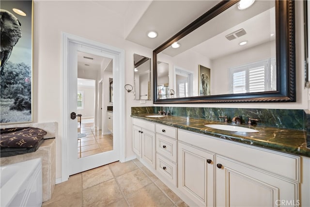35 Twin Gables, Irvine, CA 92620 - full bath with double vanity, a bathtub, and recessed lighting