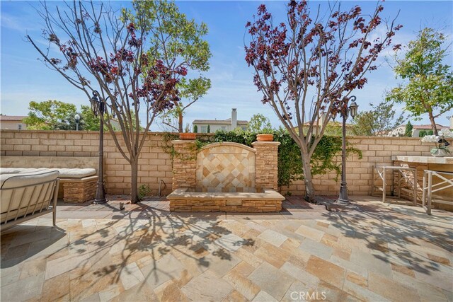 35 Twin Gables, Irvine, CA 92620 - fenced backyard with a patio