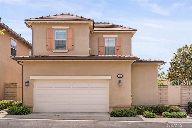 35 Twin Gables, Irvine, CA 92620 - view of front of property with an attached garage, driveway, and stucco siding