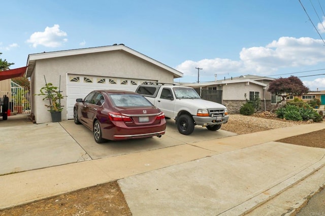 5070 Limerick Ave, Clairemont Mesa, CA 92117 - view of front of house with stucco siding, driveway, and an attached garage