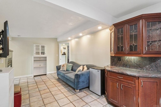 5070 Limerick Ave, Clairemont Mesa, CA 92117 - kitchen featuring refrigerator, light tile patterned floors, open floor plan, glass insert cabinets, and backsplash