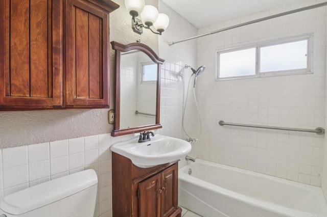 5070 Limerick Ave, Clairemont Mesa, CA 92117 - full bath with vanity, shower / washtub combination, a textured wall, and tile walls