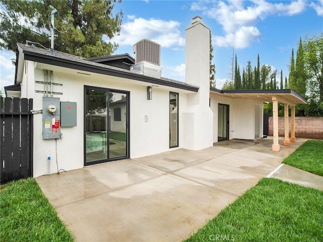 7055 Fallbrook Ave, West Hills, CA 91307 - rear view of property with a chimney, stucco siding, and a patio