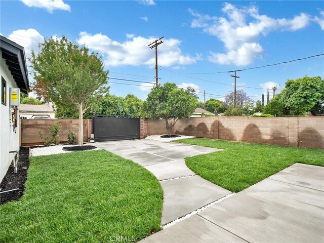 7055 Fallbrook Ave, West Hills, CA 91307 - fenced backyard with a patio area