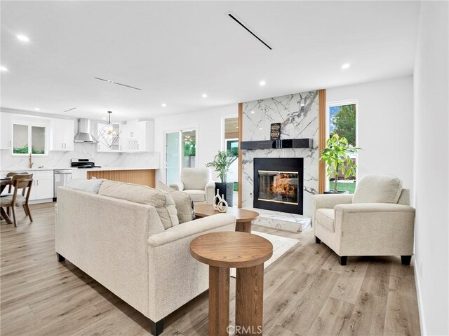 7055 Fallbrook Ave, West Hills, CA 91307 - living area with recessed lighting, light wood finished floors, and a fireplace