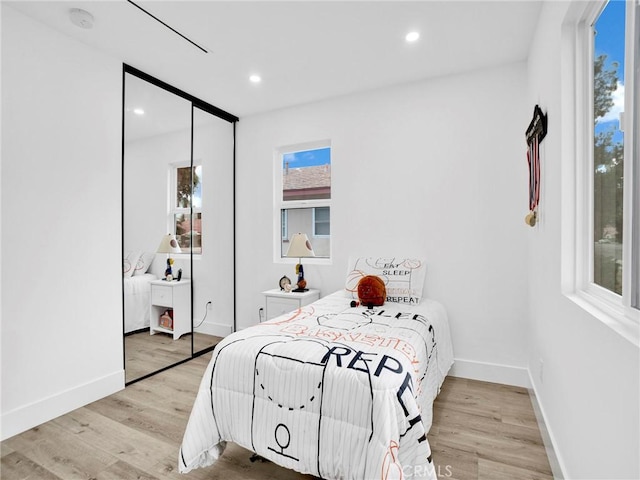 7055 Fallbrook Ave, West Hills, CA 91307 - bedroom featuring light wood-type flooring, recessed lighting, and a closet