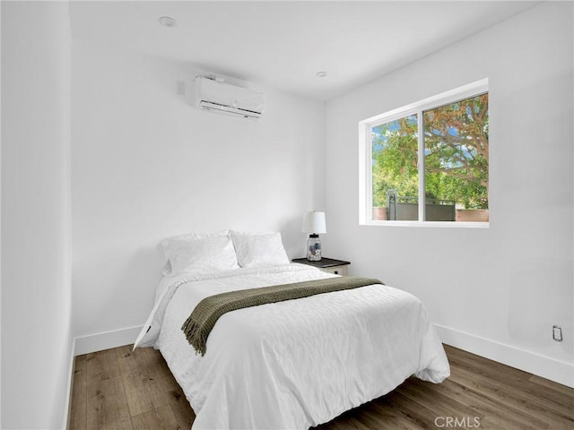 7055 Fallbrook Ave, West Hills, CA 91307 - bedroom with an AC wall unit and wood finished floors