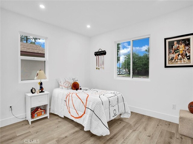 7055 Fallbrook Ave, West Hills, CA 91307 - bedroom featuring wood finished floors, multiple windows, and recessed lighting