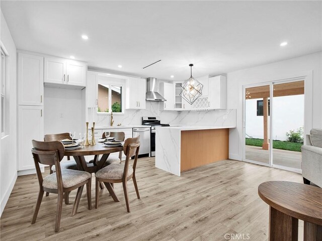 7055 Fallbrook Ave, West Hills, CA 91307 - dining space with healthy amount of natural light, light wood-style flooring, and recessed lighting