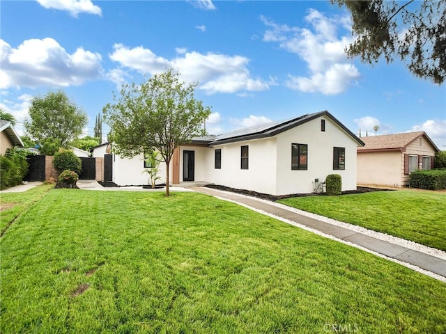 7055 Fallbrook Ave, West Hills, CA 91307 - view of front facade featuring stucco siding and solar panels